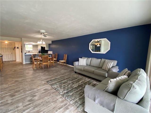 living room with hardwood / wood-style floors and ceiling fan