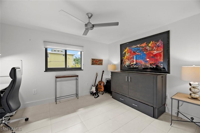 tiled office featuring ceiling fan