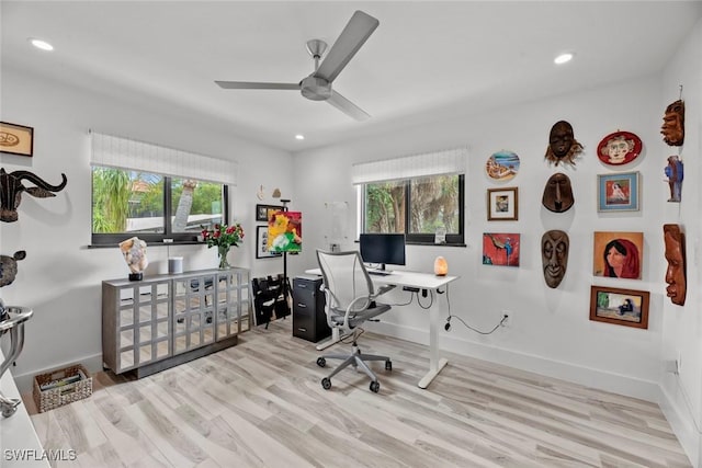 office area with ceiling fan and light hardwood / wood-style flooring