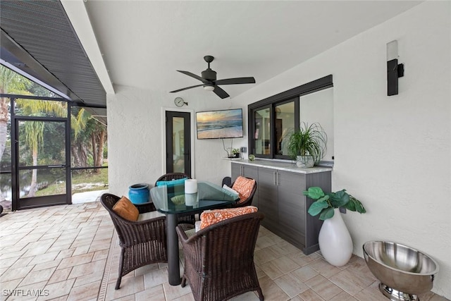 sunroom / solarium with ceiling fan