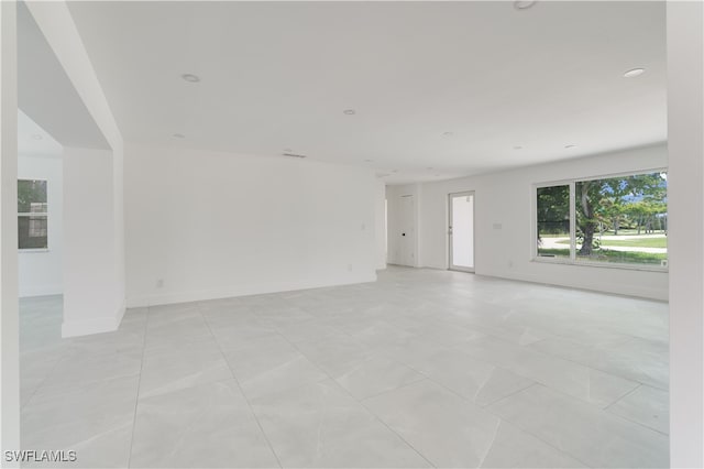 spare room with light tile patterned floors