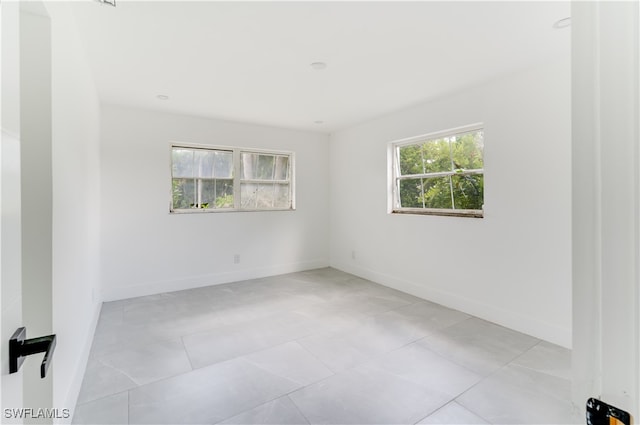 tiled empty room with plenty of natural light