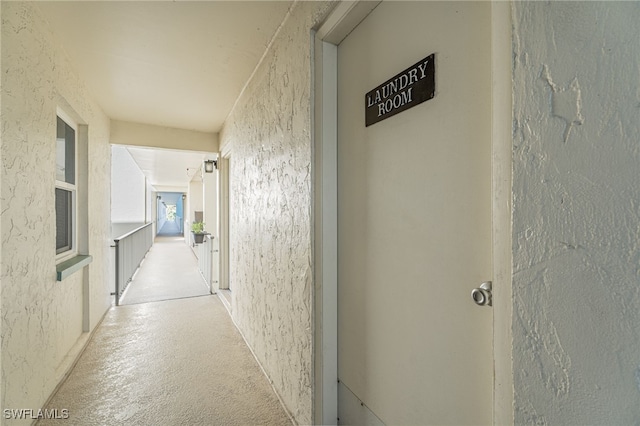 1660 Pine Valley Dr Unit 203, Fort Myers, FL 33907 - corridor featuring a textured wall