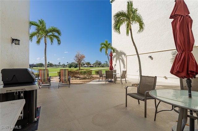 1660 Pine Valley Dr Unit 203, Fort Myers, FL 33907 - view of patio with outdoor dining area and a grill