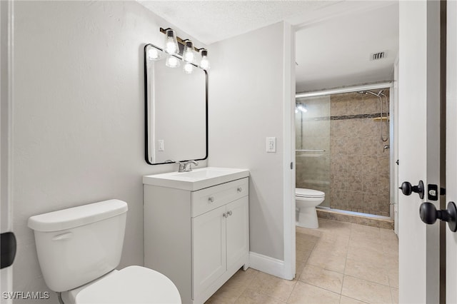 bathroom featuring vanity, tile patterned floors, toilet, and a shower with door