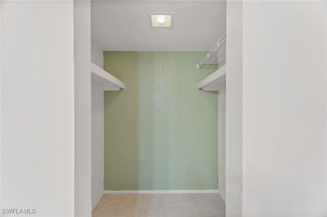 1660 Pine Valley Dr Unit 203, Fort Myers, FL 33907 - walk in closet with light tile patterned floors