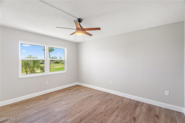 1660 Pine Valley Dr Unit 203, Fort Myers, FL 33907 - unfurnished room featuring a ceiling fan, light wood finished floors, and baseboards