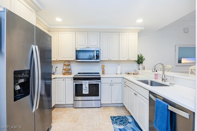 kitchen with kitchen peninsula, sink, light tile patterned floors, and stainless steel appliances