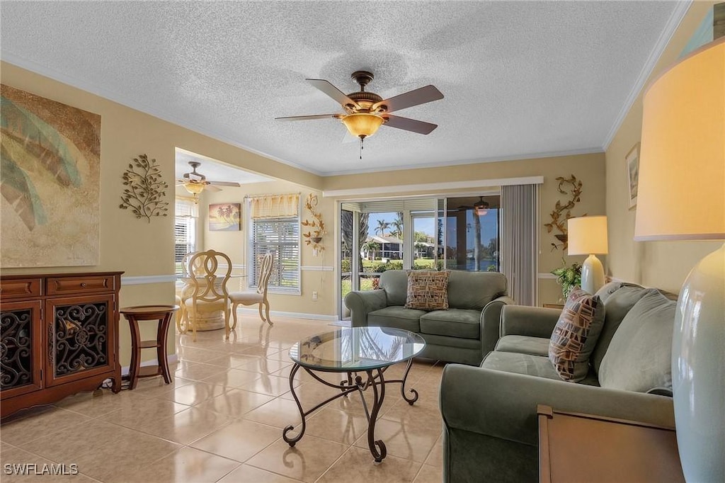 7093 Quail Run Ct W Unit 9B, Fort Myers, FL 33908 - living room with ceiling fan, plenty of natural light, light tile patterned floors, a textured ceiling, and crown molding