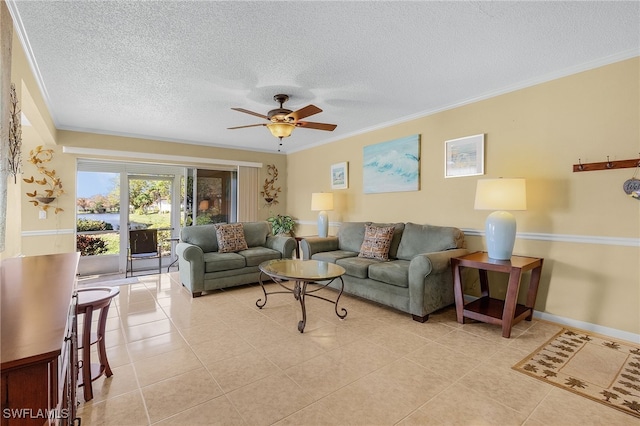 living room featuring light tile patterned flooring, ceiling fan, a textured ceiling, and ornamental molding