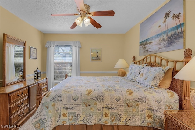 bedroom featuring a textured ceiling and ceiling fan