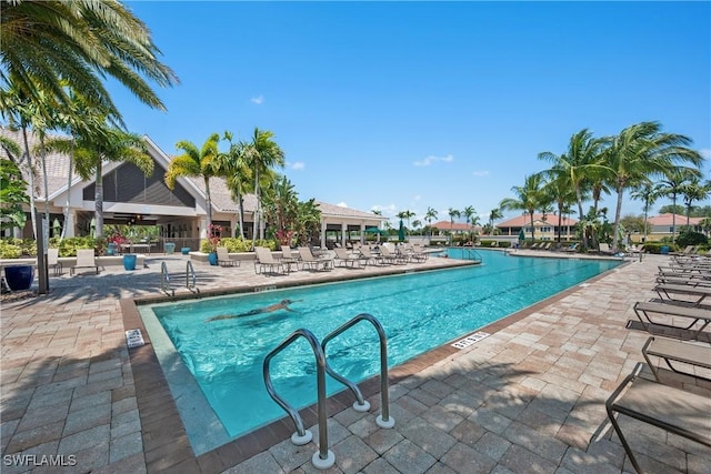 view of swimming pool with a patio