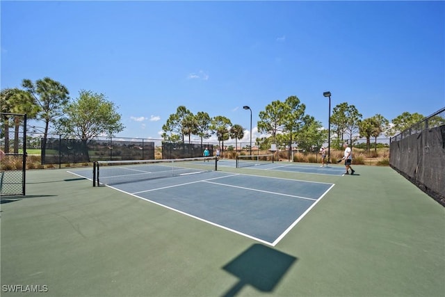 view of sport court featuring basketball hoop