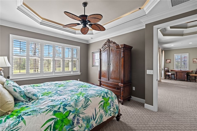 bedroom featuring crown molding, ceiling fan, a raised ceiling, and light colored carpet