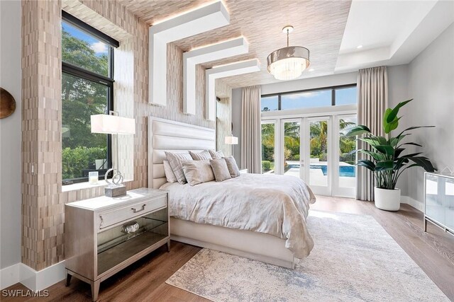 607 Myrtle Rd, Naples, FL 34108 - bedroom with access to outside, french doors, wood finished floors, and baseboards