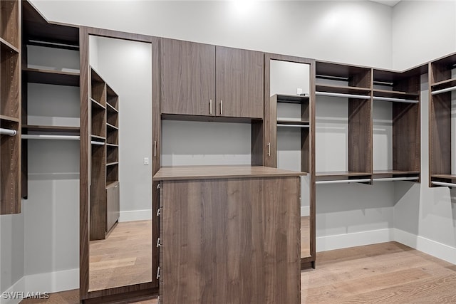 spacious closet featuring light hardwood / wood-style floors