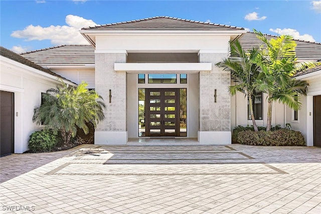 607 Myrtle Rd, Naples, FL 34108 - property entrance featuring french doors, a tile roof, and stucco siding