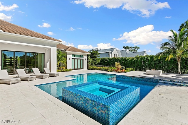 view of pool featuring an in ground hot tub and a patio