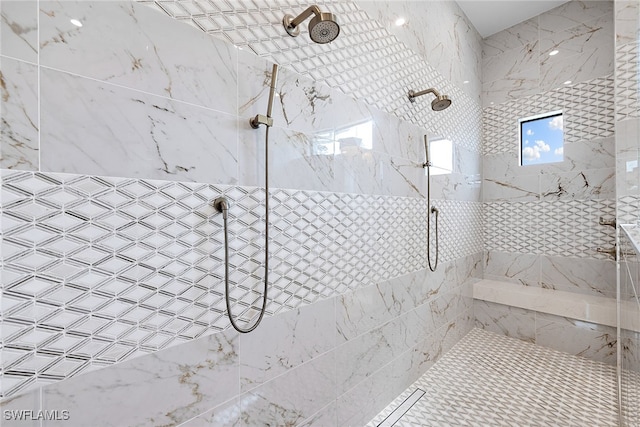 bathroom with tiled shower