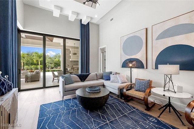 607 Myrtle Rd, Naples, FL 34108 - living area with a towering ceiling and wood finished floors