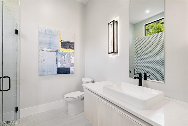 607 Myrtle Rd, Naples, FL 34108 - full bathroom with toilet, a shower stall, vanity, and baseboards