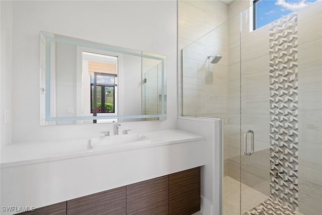 bathroom featuring vanity and walk in shower