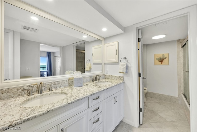 bathroom featuring walk in shower, vanity, and toilet