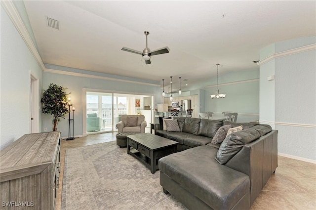 tiled living room featuring crown molding and ceiling fan with notable chandelier