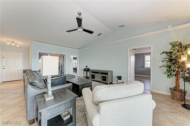 living room with crown molding, ceiling fan, light tile patterned floors, and vaulted ceiling