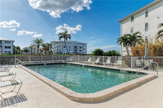 view of swimming pool featuring a patio area