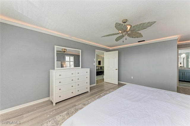 bedroom with ceiling fan, wood-type flooring, a textured ceiling, and ornamental molding