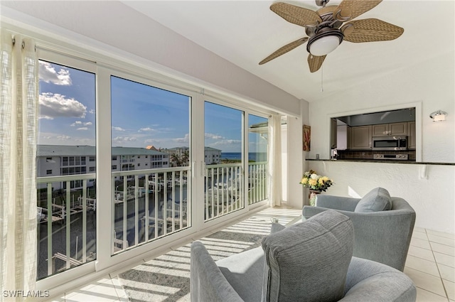 sunroom / solarium with ceiling fan and a healthy amount of sunlight