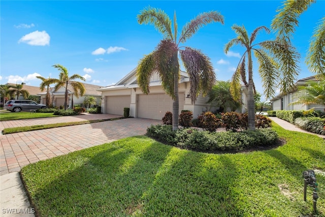 view of front of house with a garage and a front yard