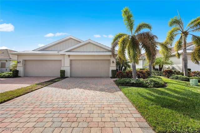 view of front facade with a garage and a front yard