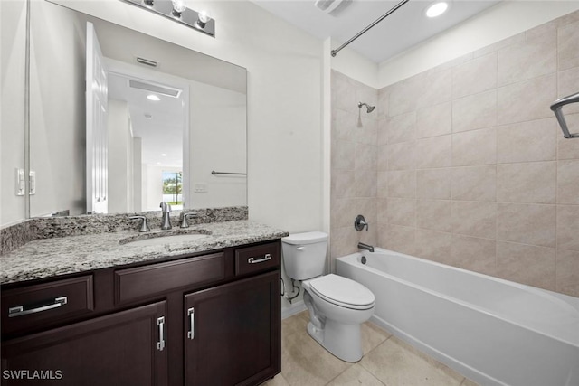 full bathroom with tile patterned floors, vanity, toilet, and tiled shower / bath