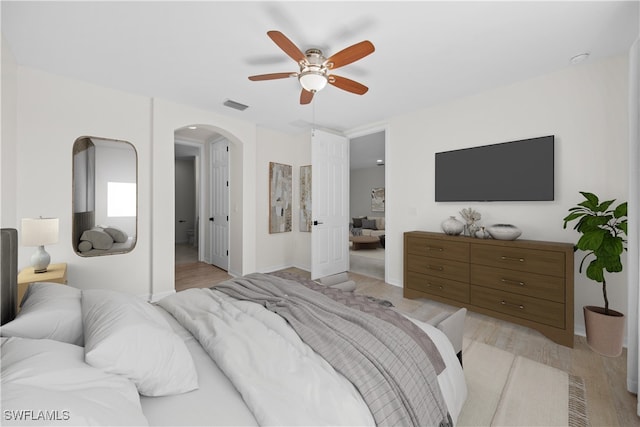 bedroom with ceiling fan and light hardwood / wood-style flooring