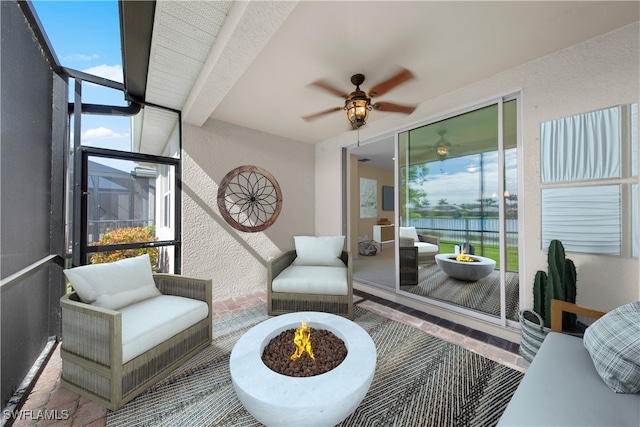 interior space featuring ceiling fan and beam ceiling