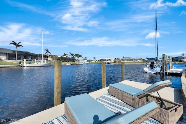 dock area featuring a lanai and a water view