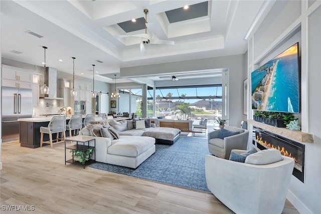 living room with coffered ceiling, beam ceiling, and light hardwood / wood-style flooring