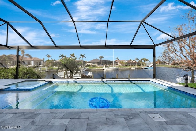 view of pool featuring a patio, a water view, and glass enclosure