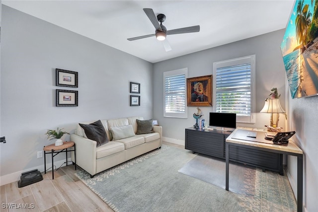 home office featuring ceiling fan and light wood-type flooring