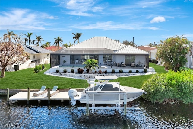 rear view of house with a water view, glass enclosure, a patio area, and a lawn