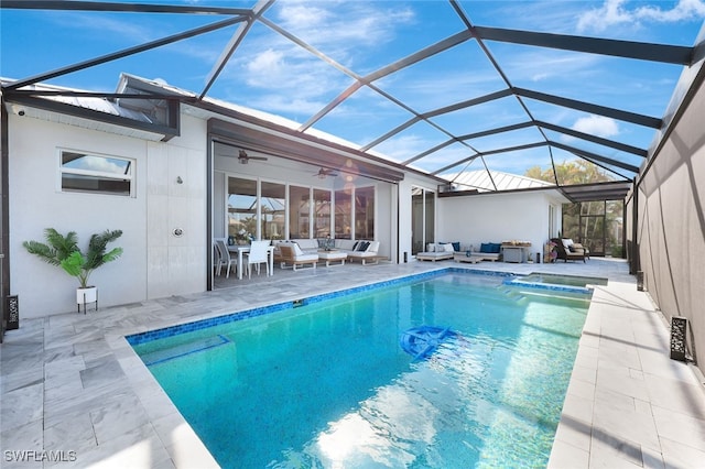 view of pool with a patio, an outdoor living space, glass enclosure, and ceiling fan