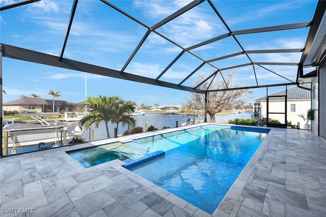 view of pool featuring an in ground hot tub, a water view, glass enclosure, and a patio area