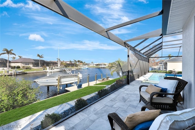 view of patio featuring glass enclosure, a dock, and a water view