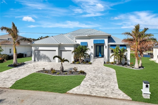 view of front facade with a garage and a front yard