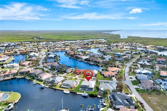 birds eye view of property featuring a water view