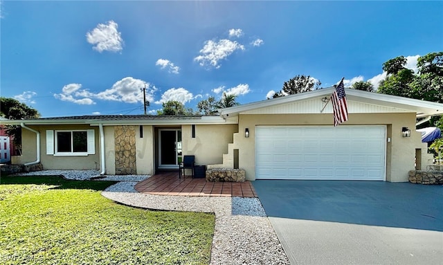 ranch-style home with a garage and a front yard