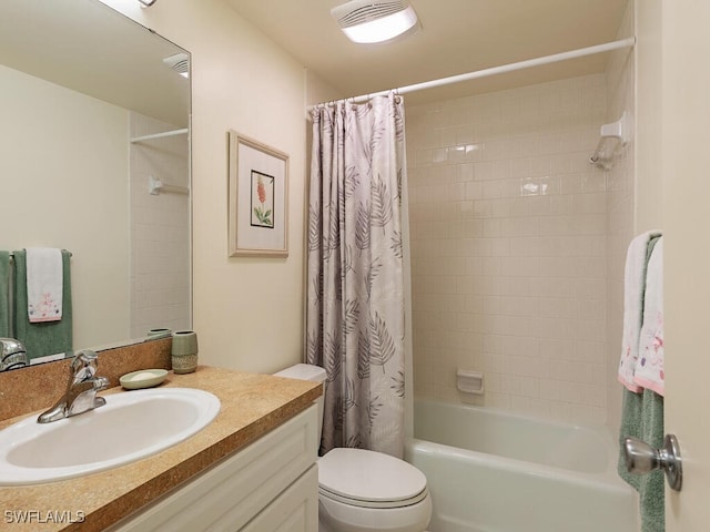 full bathroom featuring vanity, toilet, and shower / tub combo with curtain