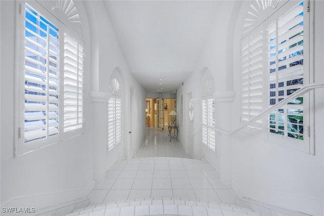 corridor with light tile patterned flooring